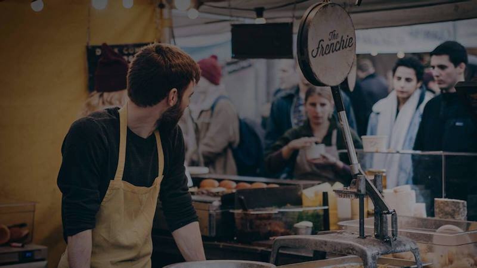 man working in shop stand