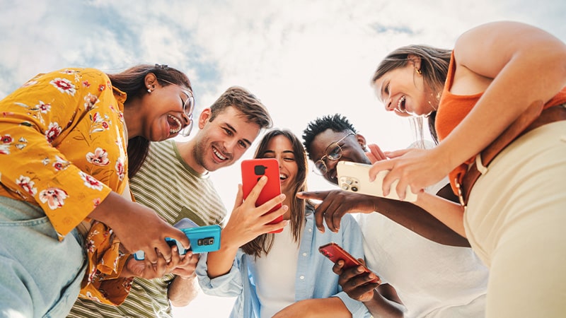 group of people looking at mobiles